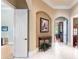 Elegant hallway with arched entryways and decorative wall accents at 3218 Signet Ct, Sarasota, FL 34240