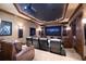 Home theater with large screen, comfortable seating, and built-in shelving at 3218 Signet Ct, Sarasota, FL 34240