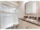 Bathroom with a walk-in shower and granite vanity at 3218 Signet Ct, Sarasota, FL 34240