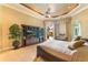 Luxurious main bedroom features a king-size bed, patio access, and views of the pool area at 3218 Signet Ct, Sarasota, FL 34240