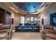 Home theater with reclining seats and a large projection screen at 3218 Signet Ct, Sarasota, FL 34240