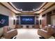 Luxurious home theater with large screen and comfortable seating at 3218 Signet Ct, Sarasota, FL 34240