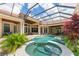 Resort style pool and spa with lush landscaping at 3218 Signet Ct, Sarasota, FL 34240