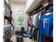 Large walk-in closet with custom built-ins and natural light at 3218 Signet Ct, Sarasota, FL 34240
