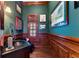 Charming powder room with dark wood paneling and a copper sink at 3218 Signet Ct, Sarasota, FL 34240