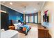 Spacious bedroom with a window seat and built-in shelving at 3218 Signet Ct, Sarasota, FL 34240