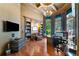 Spacious home office with hardwood floors, built-in shelves, and a large desk at 3218 Signet Ct, Sarasota, FL 34240