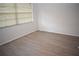 Bedroom with grey laminate flooring and window blinds at 1206 58Th W St, Bradenton, FL 34209