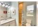 Bright bathroom with a light-colored vanity and tiled shower, offering modern comfort at 15923 29Th E St, Parrish, FL 34219