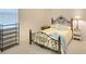 Comfortable bedroom with ornate metal bed frame and matching bedside tables for ample storage at 15923 29Th E St, Parrish, FL 34219