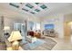 Open-concept living room with tile flooring, cozy seating, and offering a welcoming atmosphere for relaxation and entertainment at 15923 29Th E St, Parrish, FL 34219