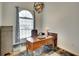 Bright home office featuring a wooden desk, an area rug, a window, and offering a functional workspace at 15923 29Th E St, Parrish, FL 34219
