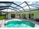Screened in outdoor pool area with tile flooring and lounge chairs at 15923 29Th E St, Parrish, FL 34219