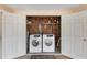 Shared laundry room with two sets of washer and dryer at 5055 Live Oak Cir, Bradenton, FL 34207