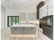 Modern kitchen featuring a large island and stainless steel appliances at 13457 Drysdale Ave, Port Charlotte, FL 33981