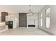 Spacious living area featuring a fireplace and large windows offering natural light at 13457 Drysdale Ave, Port Charlotte, FL 33981