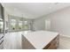 Bright and spacious living area with large windows and hardwood floors at 13457 Drysdale Ave, Port Charlotte, FL 33981