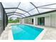 Relaxing pool and patio with covered lanai at 13457 Drysdale Ave, Port Charlotte, FL 33981