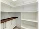Well-organized pantry with white shelves and a butcher block countertop at 13457 Drysdale Ave, Port Charlotte, FL 33981
