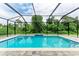 Inviting screened-in pool with ample deck space at 13457 Drysdale Ave, Port Charlotte, FL 33981