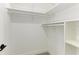 Large walk-in closet with hanging rods and shelving at 13457 Drysdale Ave, Port Charlotte, FL 33981