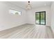 Bedroom with pool view, sliding glass doors and modern light fixture at 13457 Drysdale Ave, Port Charlotte, FL 33981