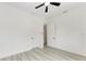 Bedroom with ceiling fan and access to another room at 13457 Drysdale Ave, Port Charlotte, FL 33981