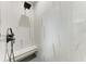 Walk-in shower with marble-look tile and built-in seat at 13457 Drysdale Ave, Port Charlotte, FL 33981