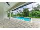 Modern, screened pool with spacious patio at 13457 Drysdale Ave, Port Charlotte, FL 33981