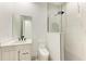 Clean bathroom with a single vanity, toilet, and shower at 13457 Drysdale Ave, Port Charlotte, FL 33981