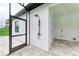 Outdoor shower near the pool with modern tile and fixtures at 13457 Drysdale Ave, Port Charlotte, FL 33981