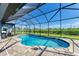 Relaxing kidney-shaped pool with screened enclosure at 13416 Trascoro Ln, Port Charlotte, FL 33981