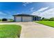 Three-car garage with screened-in entry at 13416 Trascoro Ln, Port Charlotte, FL 33981