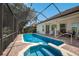 Large pool and spa with screened enclosure and patio at 7316 43Rd E St, Sarasota, FL 34243