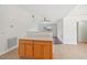 Kitchen island with wood cabinets and a view into the living room at 4288 Birnam Ter, North Port, FL 34286