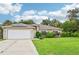 Single-story home with solar panels and a well-manicured lawn at 4288 Birnam Ter, North Port, FL 34286