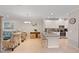 Open kitchen with a breakfast bar that overlooks the living room at 12710 Sorrento Way # 101, Bradenton, FL 34211