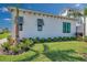 Landscaped yard with gray shutters and lush green grass at 5932 Red Mangrove Ln, Bradenton, FL 34210