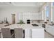 Modern kitchen with white cabinets and large island at 5932 Red Mangrove Ln, Bradenton, FL 34210