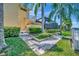 Landscaped walkway leading to the canal and backyard at 4735 Halyard Dr, Bradenton, FL 34208