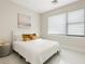 Guest bedroom with a comfortable bed and gold accent pillows at 2170 Fruitville Rd, Sarasota, FL 34237