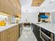 Modern kitchen with marble island and stainless steel appliances at 2170 Fruitville Rd, Sarasota, FL 34237