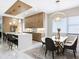 Modern kitchen with island, marble counters, and gold accents at 2170 Fruitville Rd, Sarasota, FL 34237