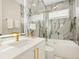 Modern bathroom with marble shower and gold finishes at 2170 Fruitville Rd, Sarasota, FL 34237
