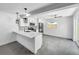 Modern kitchen with white cabinets, quartz countertops, and island at 430 Tanager Rd, Venice, FL 34293