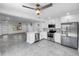 Modern kitchen featuring stainless steel appliances and white cabinetry at 430 Tanager Rd, Venice, FL 34293