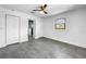 Spacious bedroom with grey tile floors and access to bathroom at 430 Tanager Rd, Venice, FL 34293