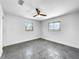 Bright bedroom with grey tile floors and two windows at 430 Tanager Rd, Venice, FL 34293