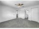 Well-lit bedroom with grey tile floors and access to bathroom at 430 Tanager Rd, Venice, FL 34293