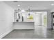 Modern kitchen with white cabinets, quartz countertops, and island at 430 Tanager Rd, Venice, FL 34293